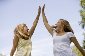 Teenage girls High-Five